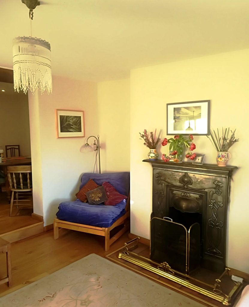 Oak flooring and open fire in West Norfolk holiday cottage